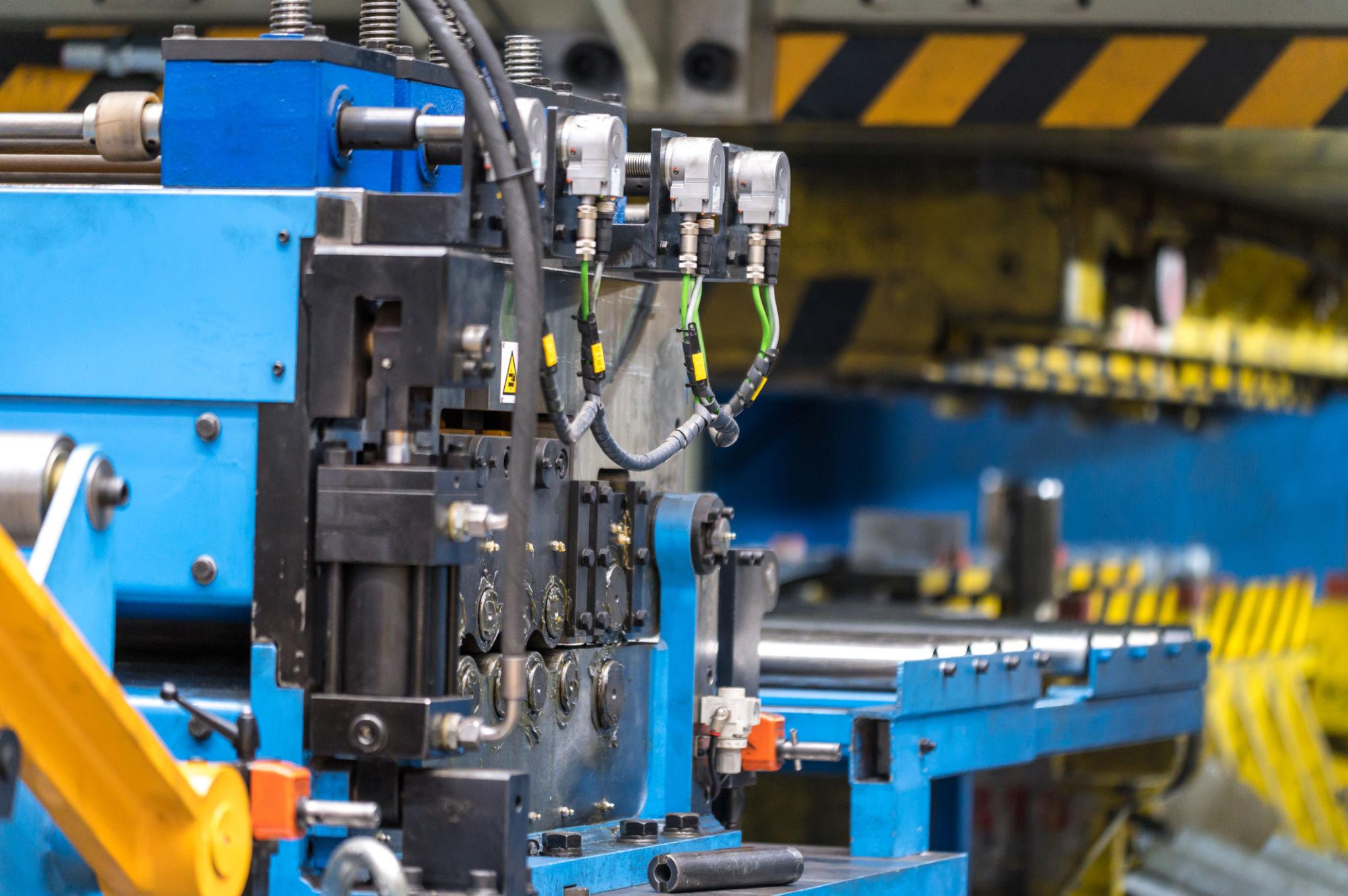 Precision press tool manufacturing machine operating in an industrial production facility at GOALTECH Industries